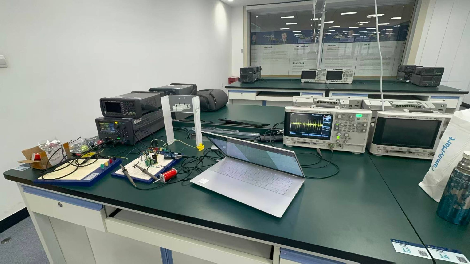 FIG.03 · Test bench with the breadboarded controller and bench supplies